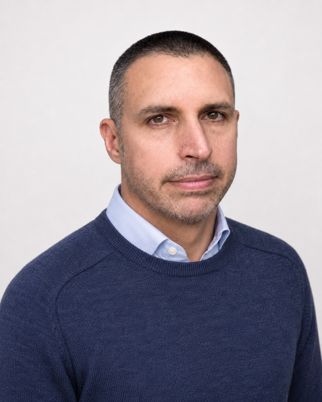 Portrait of David Halliday wearing a navy sweater